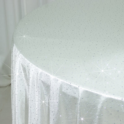Sparkling white tablecloth with rhinestones on a round table.