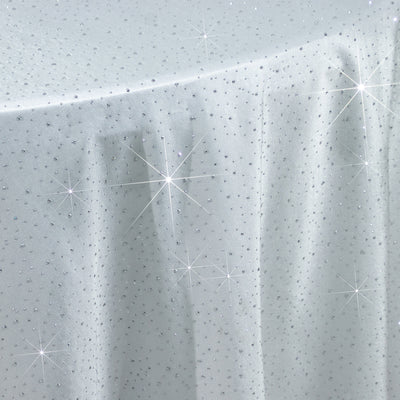 White fabric with sparkling embellishments and delicate texture.