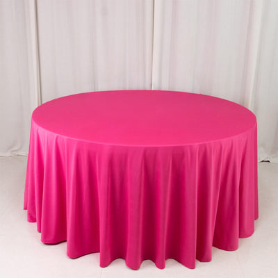 Pink round tablecloth on studio backdrop