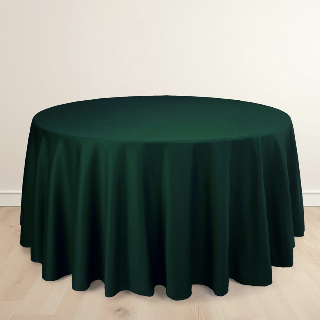 Round green tablecloth on a plain background.