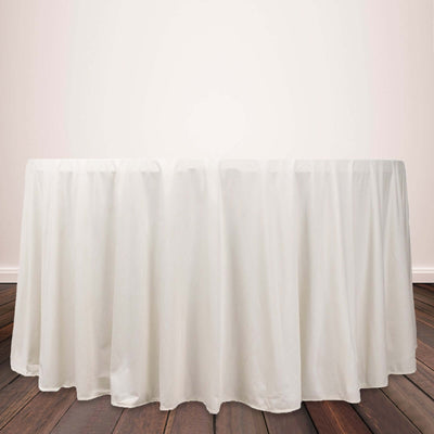 White tablecloth draped elegantly over a round table