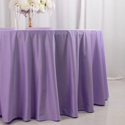 Purple tablecloth draped elegantly over a table in a softly lit setting.
