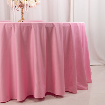 Pink tablecloth draping elegantly over a table surface.