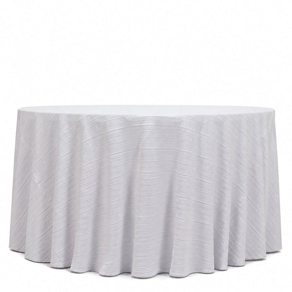 Round white table with textured draped tablecloth on a white background