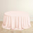 Round pink tablecloth draped elegantly over a table