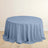 Round blue tablecloth draped elegantly on a circular table.