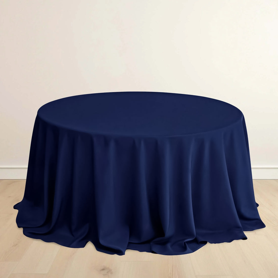 Navy round tablecloth draped elegantly over a circular table