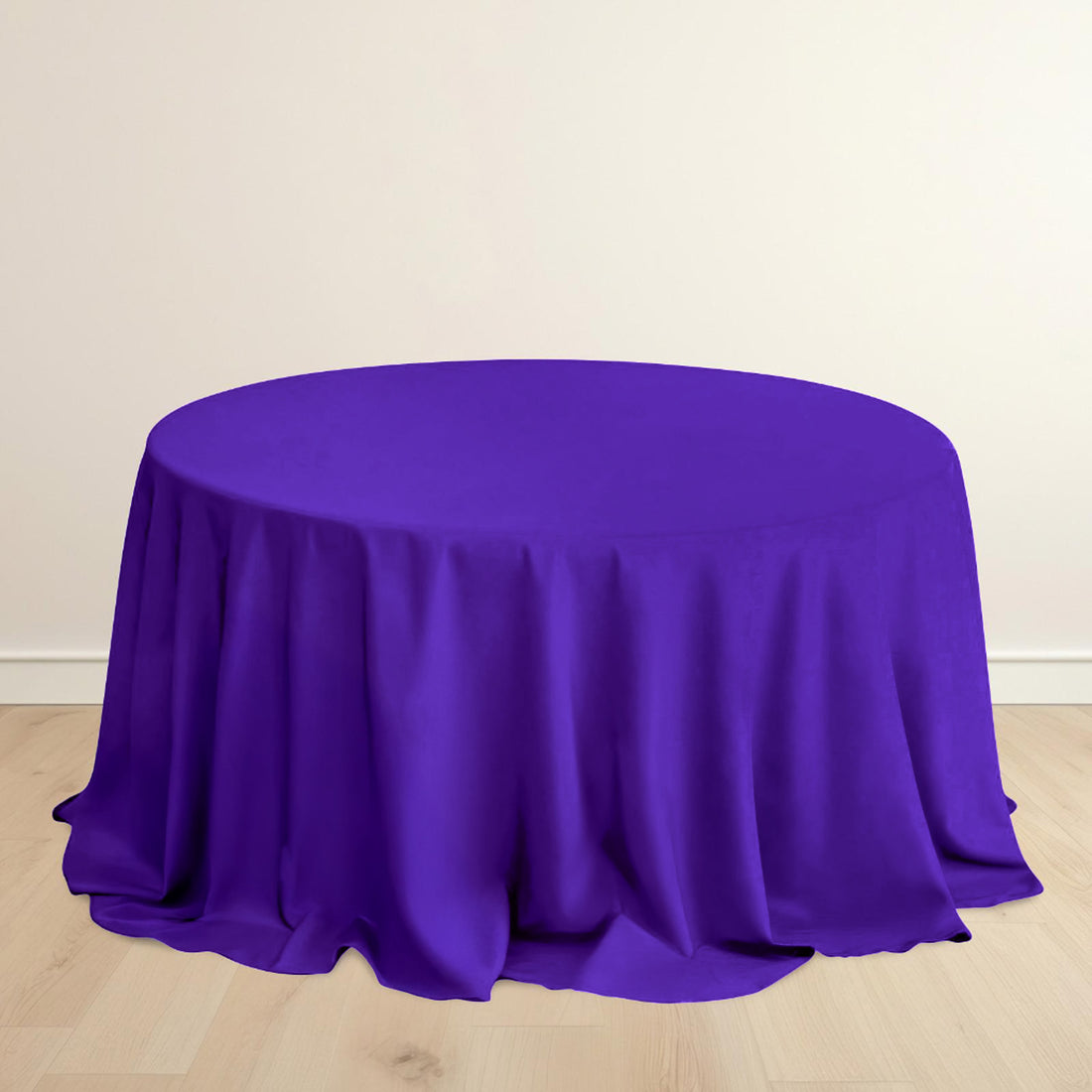 Purple round tablecloth draping elegantly on a table