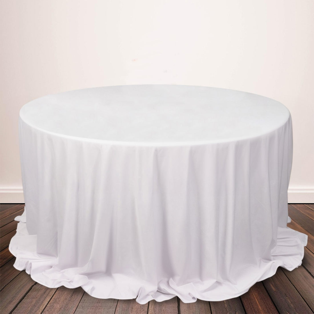 Round white tablecloth draped elegantly over a circular table