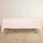 Pink tablecloth draped over a table against a plain background.