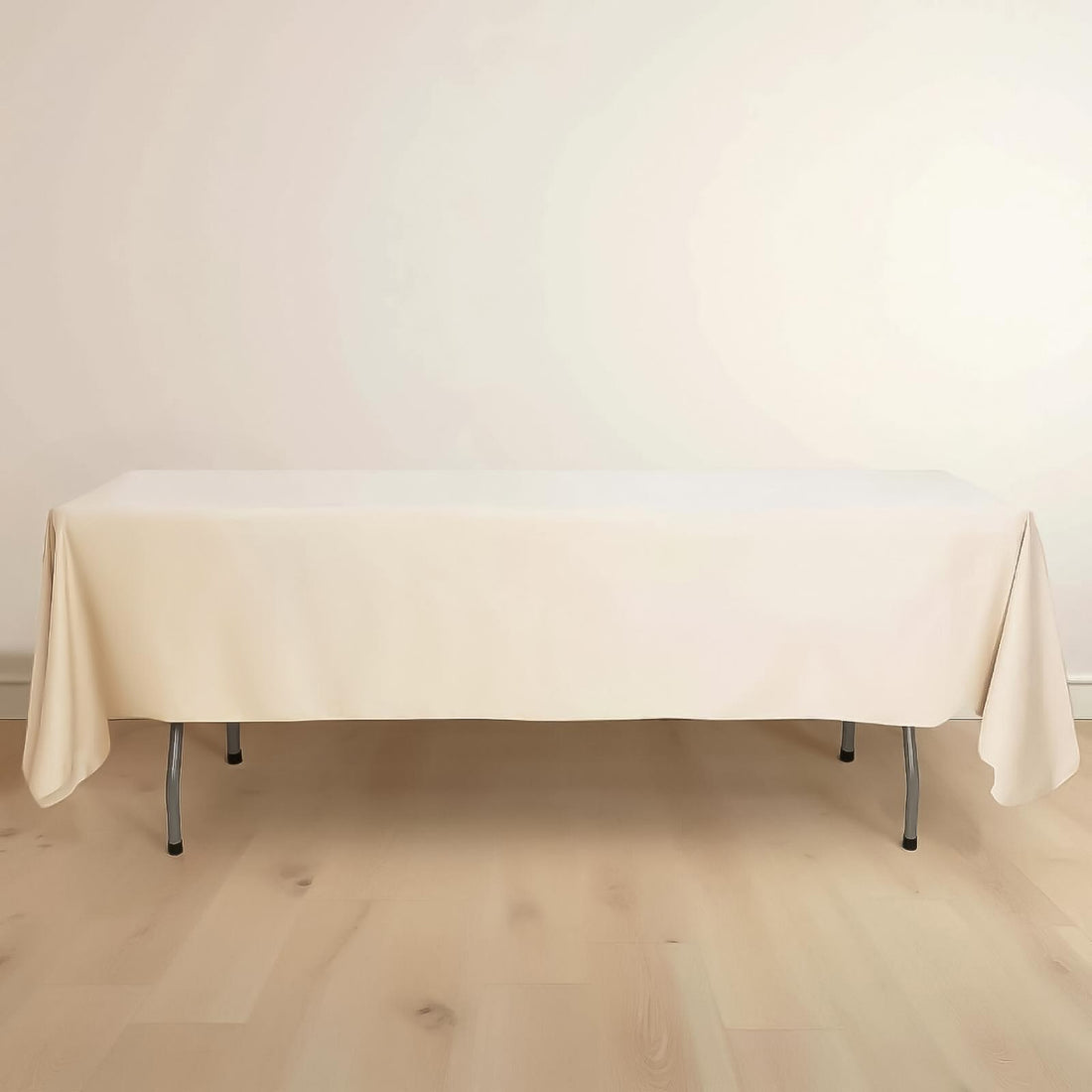 Beige tablecloth draped over a table in a studio setting