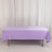 Purple tablecloth draped over a table in a studio setting