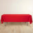 Red tablecloth draped over a folding table on a plain background.