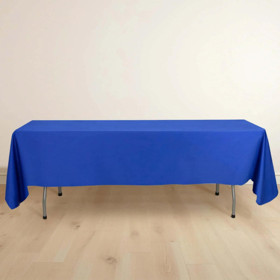 Blue tablecloth draped over a table in a studio setting.