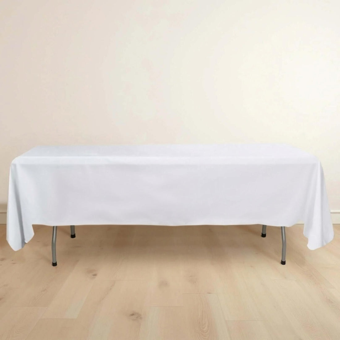 White tablecloth draped over a folding table