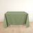 Green tablecloth on a white table against a light background.