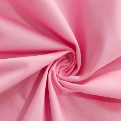 Pink fabric swirl showcasing texture and softness.