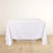 White tablecloth draping over a table on a light wooden floor.