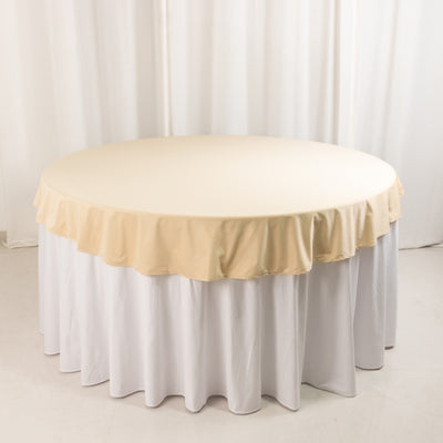 Round table with beige and white tablecloths