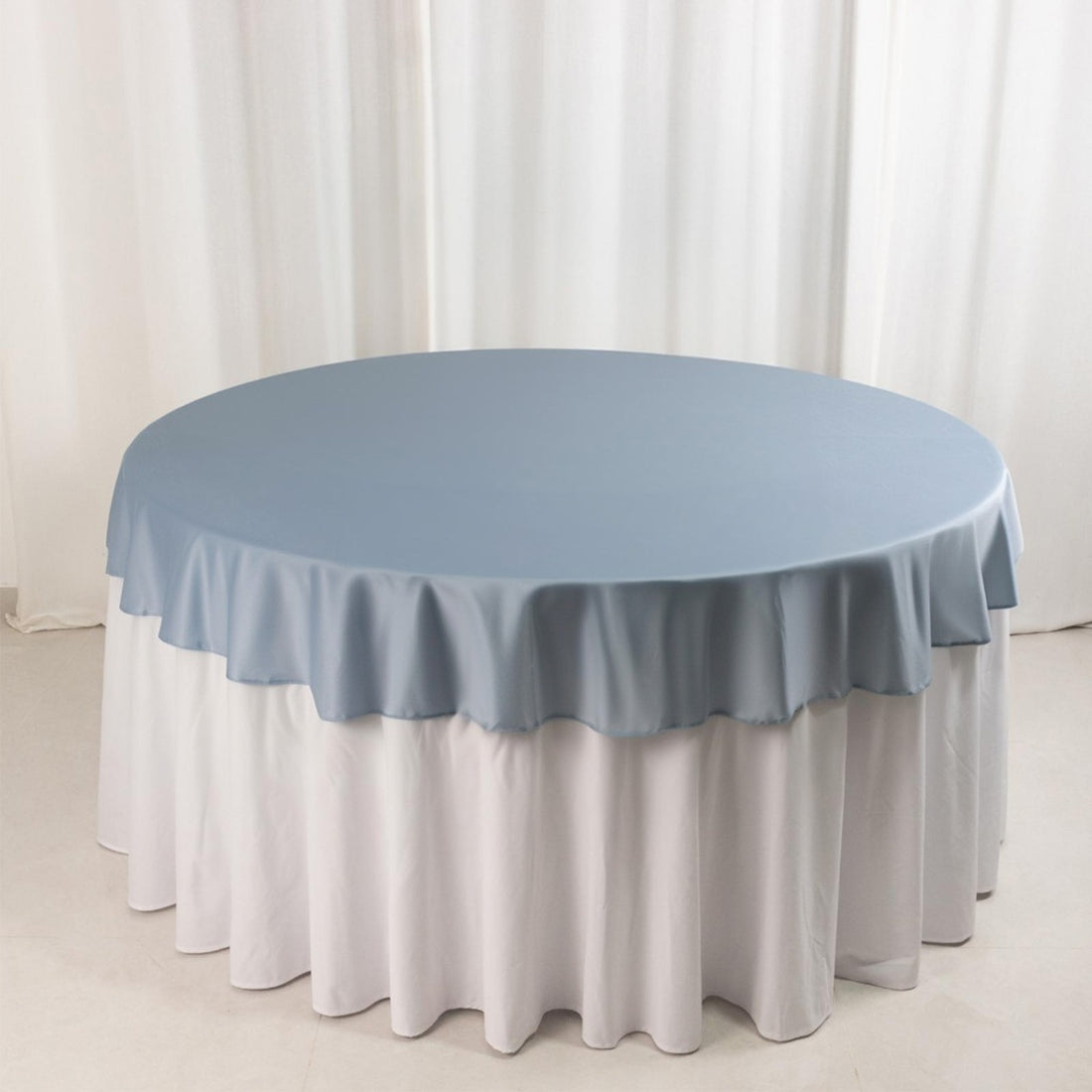 Round table with a blue and white tablecloth