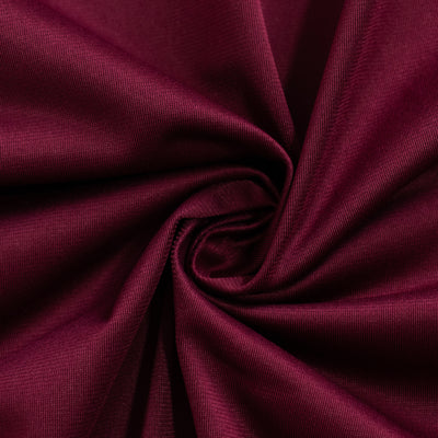Burgundy fabric texture close-up showing soft, smooth draping qualities.