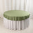 Round olive green tablecloth draped over a white table skirt.