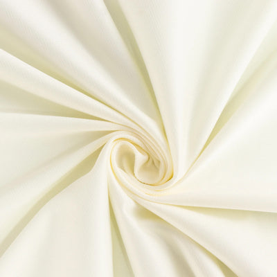 Cream-colored fabric with smooth texture and soft drape.
