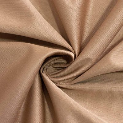 Beige fabric texture in a spiral pattern.