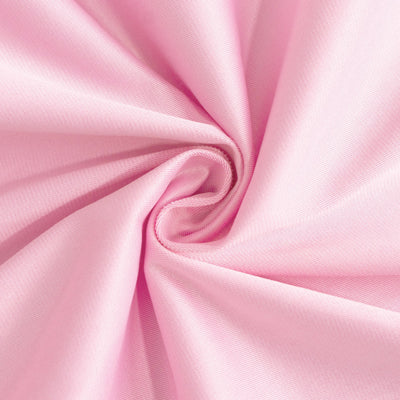 Pink fabric texture in a swirling pattern.