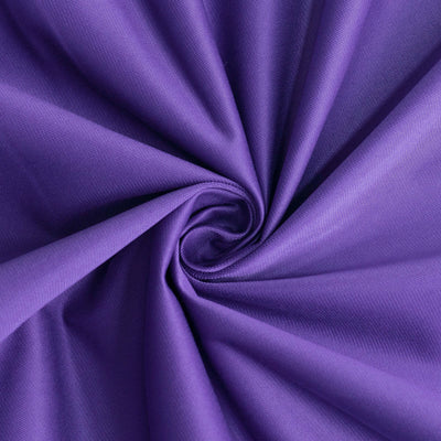 Purple fabric in a spiral pattern showcasing texture and color.