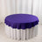 Purple round tablecloth with ruffled edges on a white table.