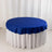 Blue round tablecloth draped over a white table.