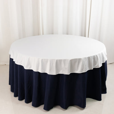 Round table with white and navy tablecloth