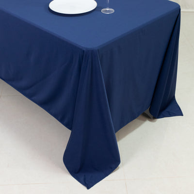 Navy tablecloth draped elegantly over a table with a plate and glass