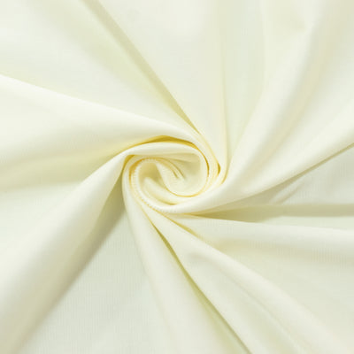 Light yellow fabric swirl showing texture and drape. #whtbkgd