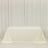 Plain white table with a cream-colored tablecloth draped elegantly.