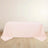 Pink tablecloth draped on a table against a plain background.