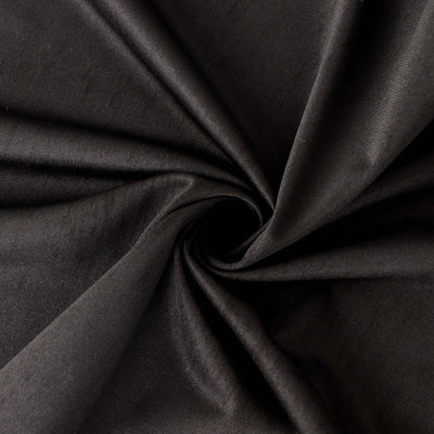 Black fabric texture in a swirling pattern.