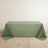 Green tablecloth draped elegantly over a table on a light wooden floor.
