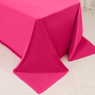 Close-up of hot pink tablecloth draped over table