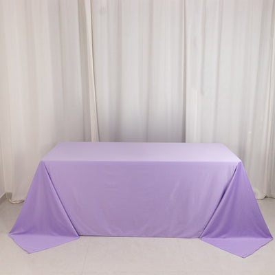 Purple tablecloth draped over a table against a plain background.