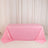 Pink tablecloth draped elegantly over a table in a studio setting