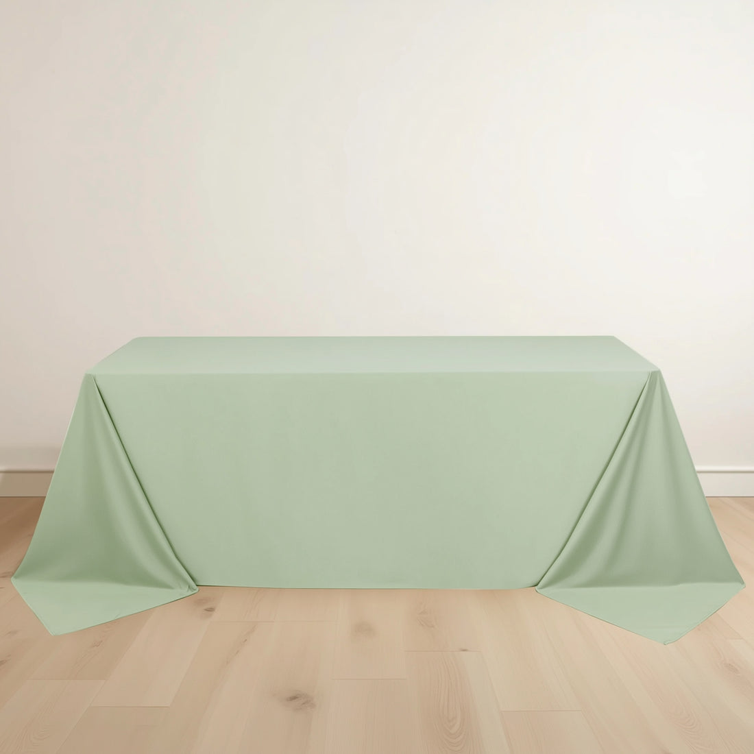 Mint green tablecloth draped elegantly over a table