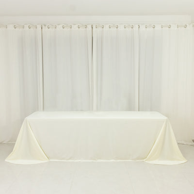 White table with a smooth tablecloth draped elegantly over it.