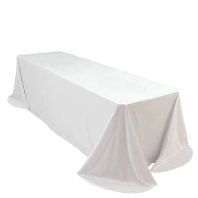 White table covered with a smooth tablecloth, elegantly draped for events