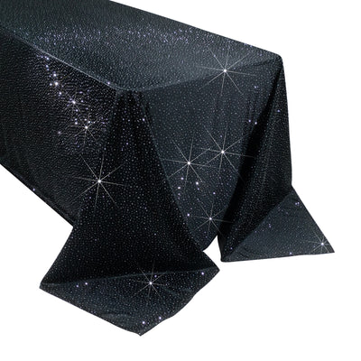 Black tablecloth with sparkling star pattern, perfect for elegant events.