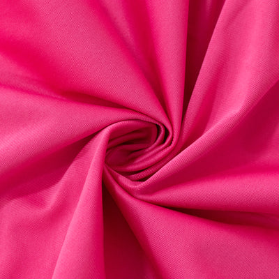 Bright pink fabric swirled in a circular pattern, showcasing texture and color. #whtbkgd