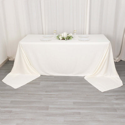 Elegant white tablecloth draped over a table for event decoration.