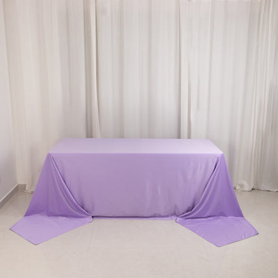 Purple tablecloth draped elegantly over a table in a minimalist setting.