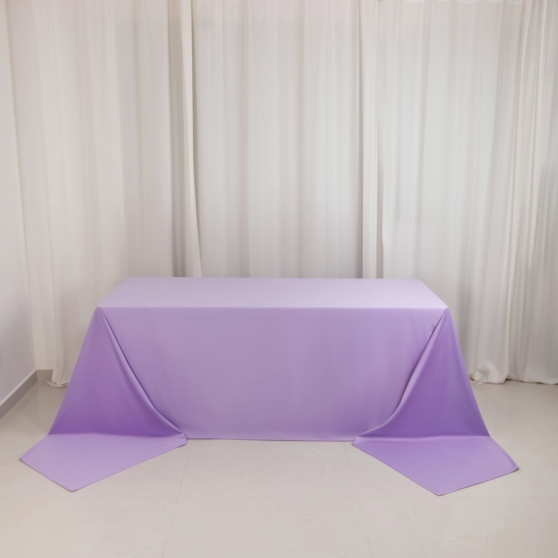 Purple tablecloth draped elegantly over a table in a studio setting.